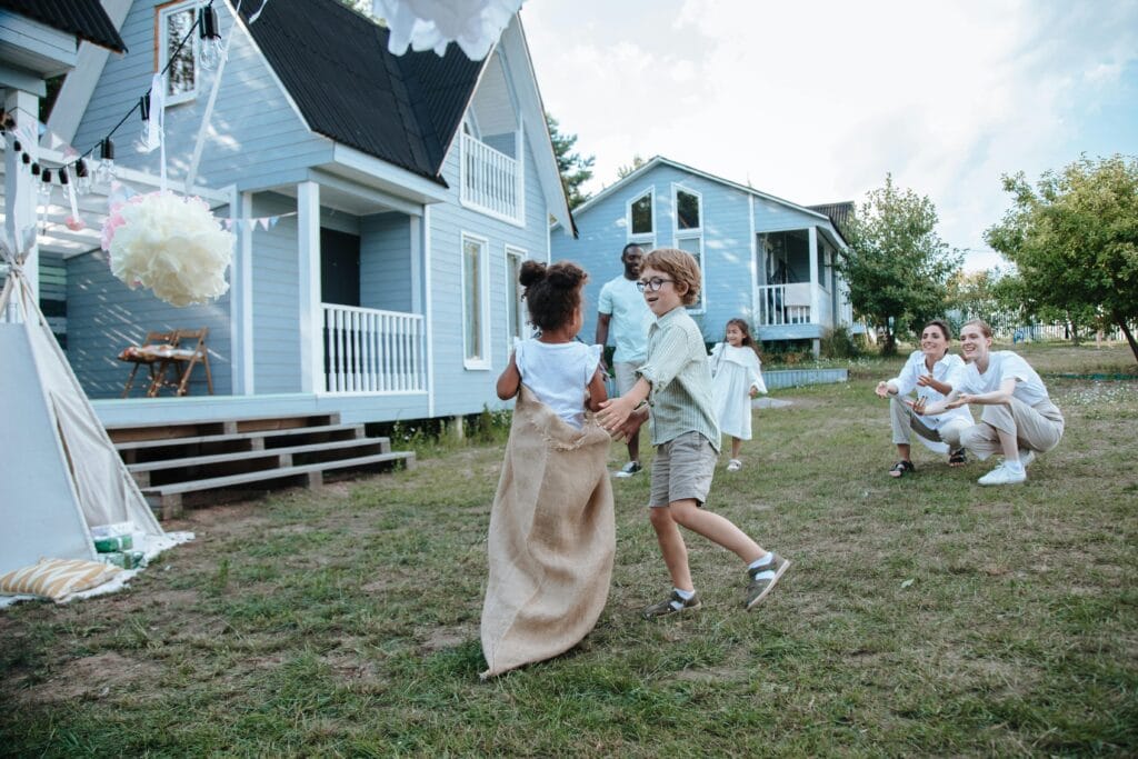 A man playing sack race game with his family