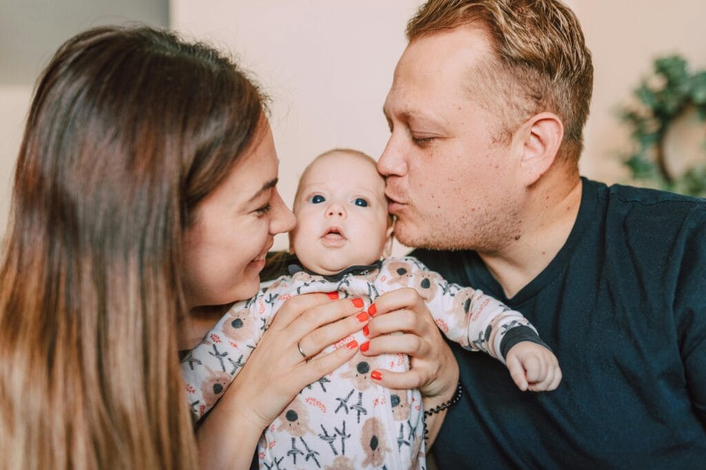 A man, his wife and new baby